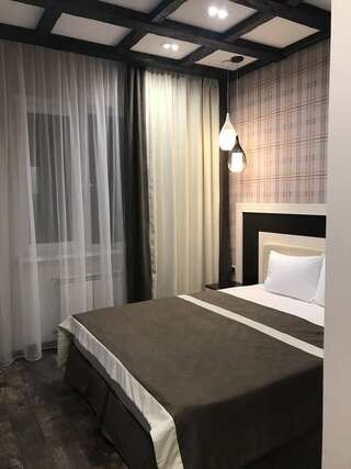 Гостиница Aruchat Hotel Домбай Улучшенный двухместный номер с 1 кроватью или 2 отдельными кроватями-1